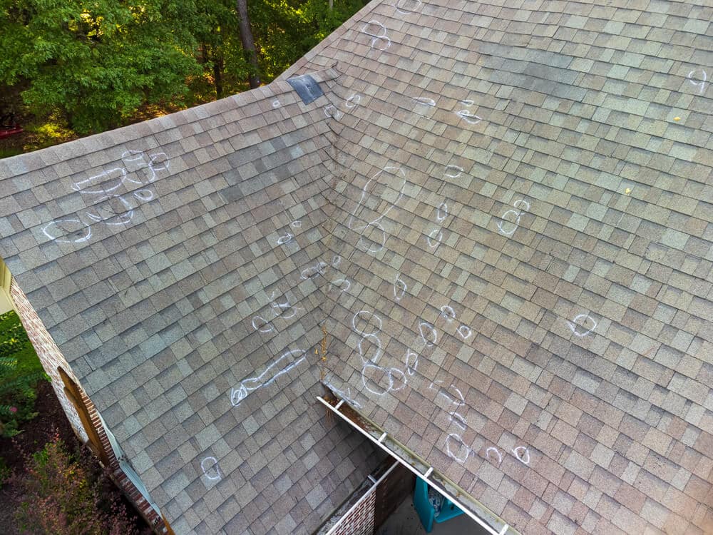 hail storm damage on asphalt shingles