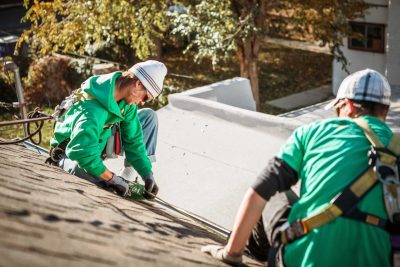 two roofing contractors working