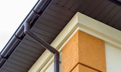 close up detail of a roof with downspout and gutter