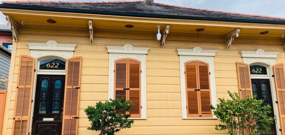 Historic New Orleans home with an old shingle roof that may contain asbestos
