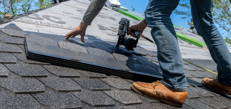 Roofing contractor installing a wind-resistant FORTIFIED roof on a Louisiana home