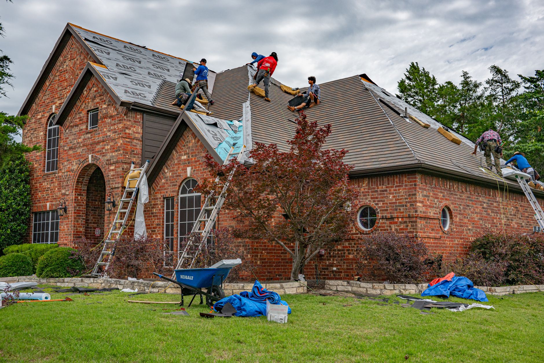Roofing contractor taking a geo-tagged photo during a New Orleans re-roofing permit inspection