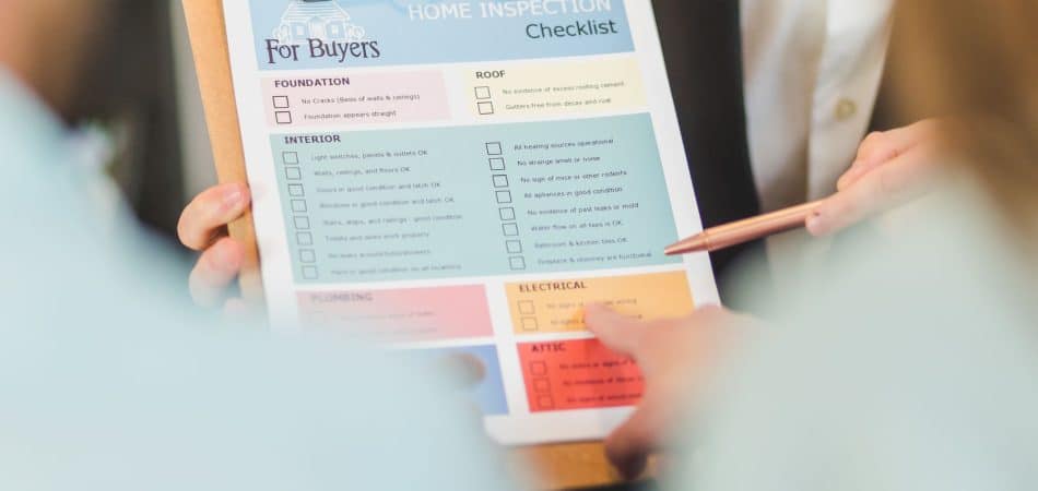Homeowner reviewing roof replacement permit paperwork for a New Orleans home