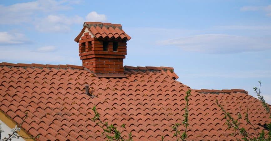Clay tile roof on a New Orleans style home showing full roof coverage