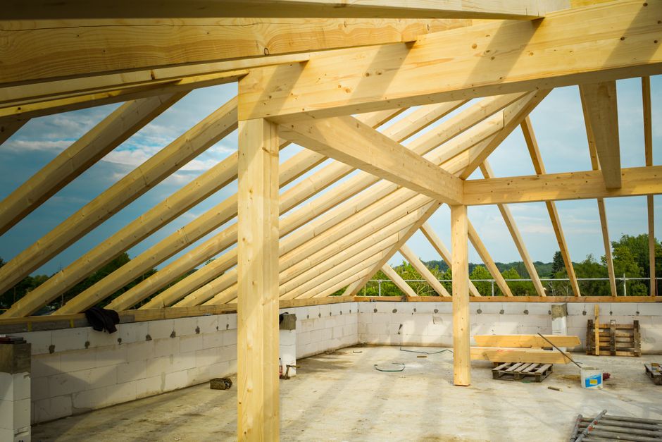 Rafters and roof framing exposed during a structural inspection for tile roofing
